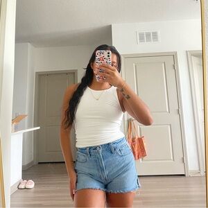 White Tank Top and Blue Denim Shorts